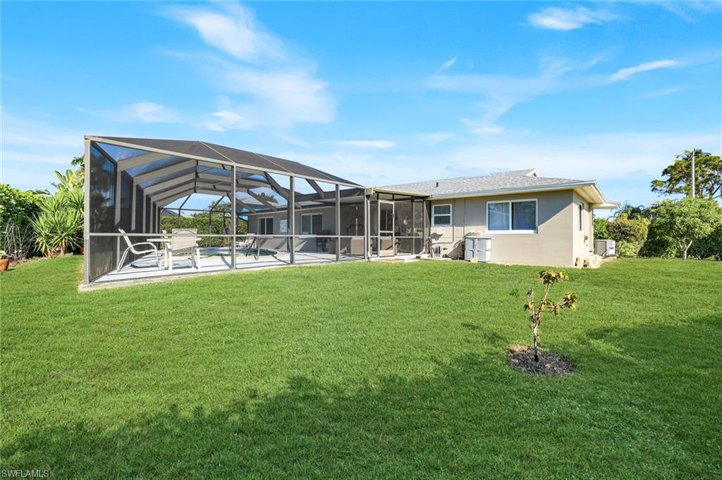 1237 Jamaica Road Marco Island, FL 34145 - Photo 24 of 26 a view of house with a backyard