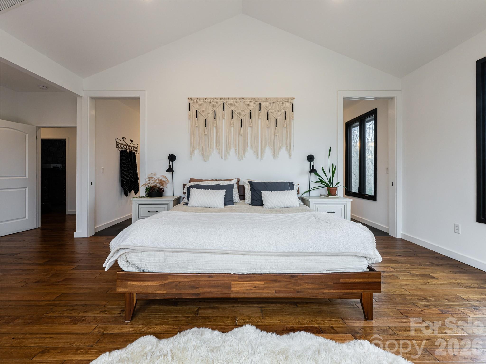 508 Avery Creek Road Arden, NC 28704 - Photo 12 of 47 a bedroom with a bed and wooden floor