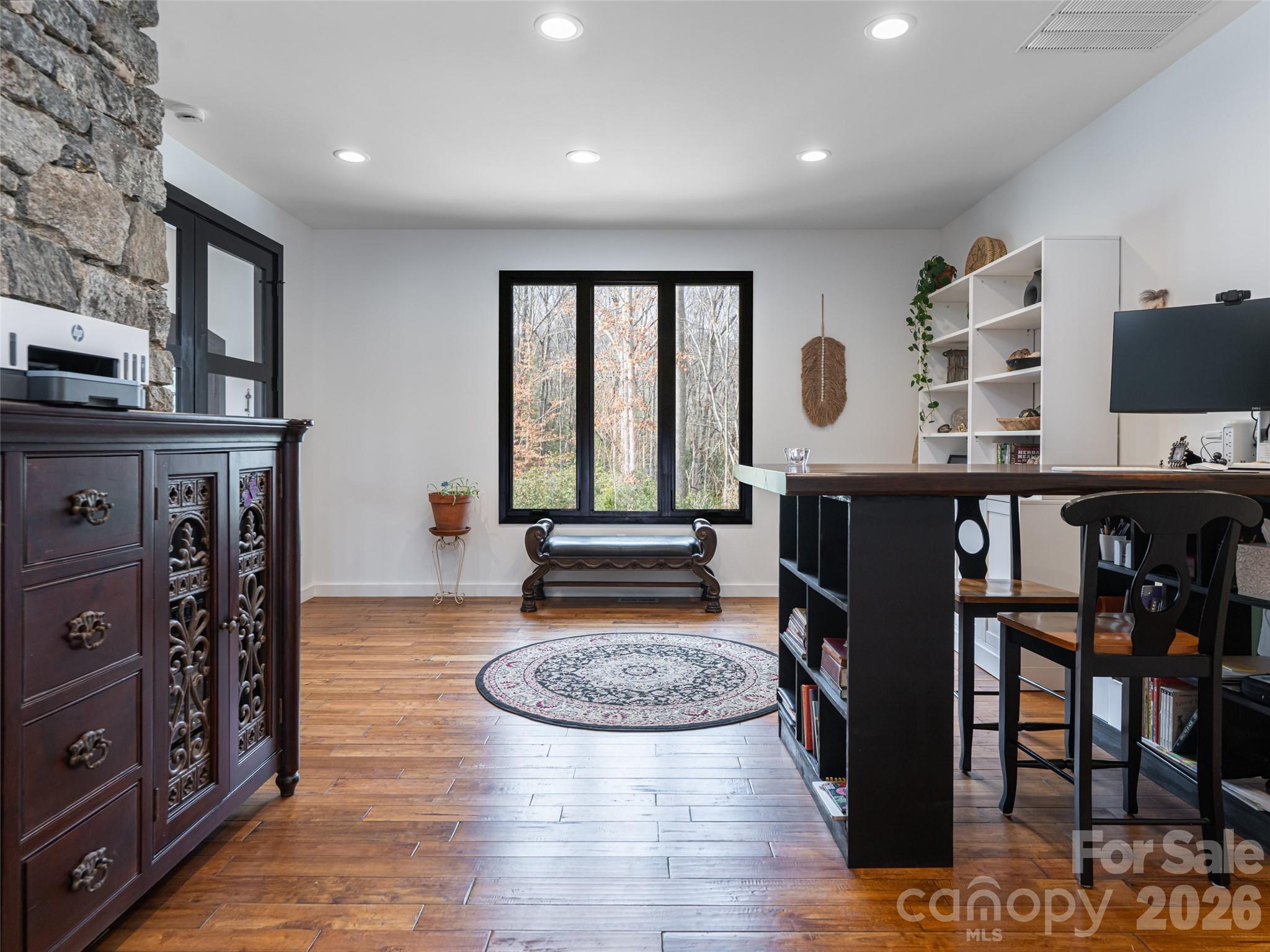 508 Avery Creek Road Arden, NC 28704 - Photo 21 of 47 a living room with furniture a fireplace and a flat screen tv