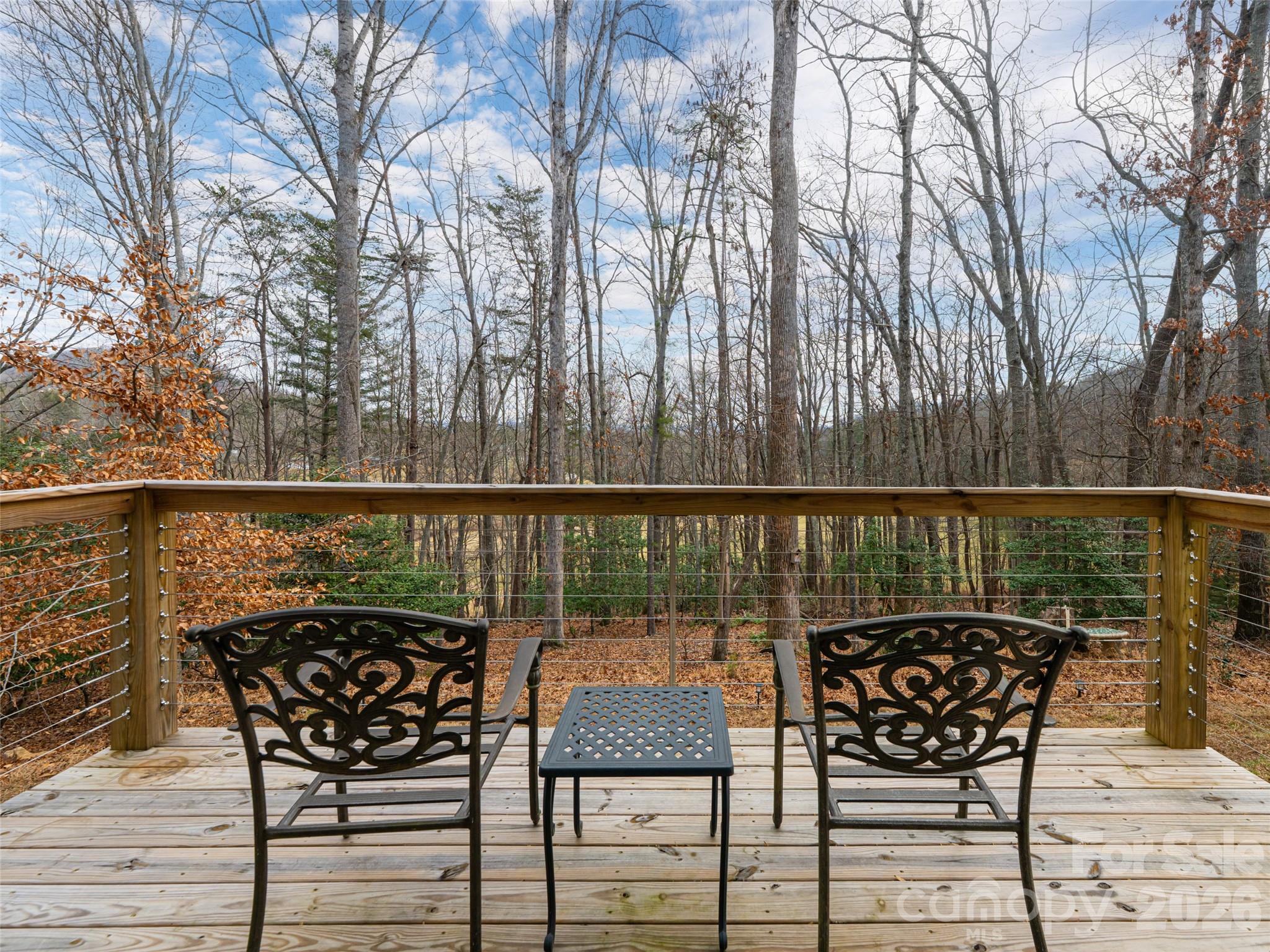 508 Avery Creek Road Arden, NC 28704 - Photo 26 of 47 a view of a chairs and table on the deck