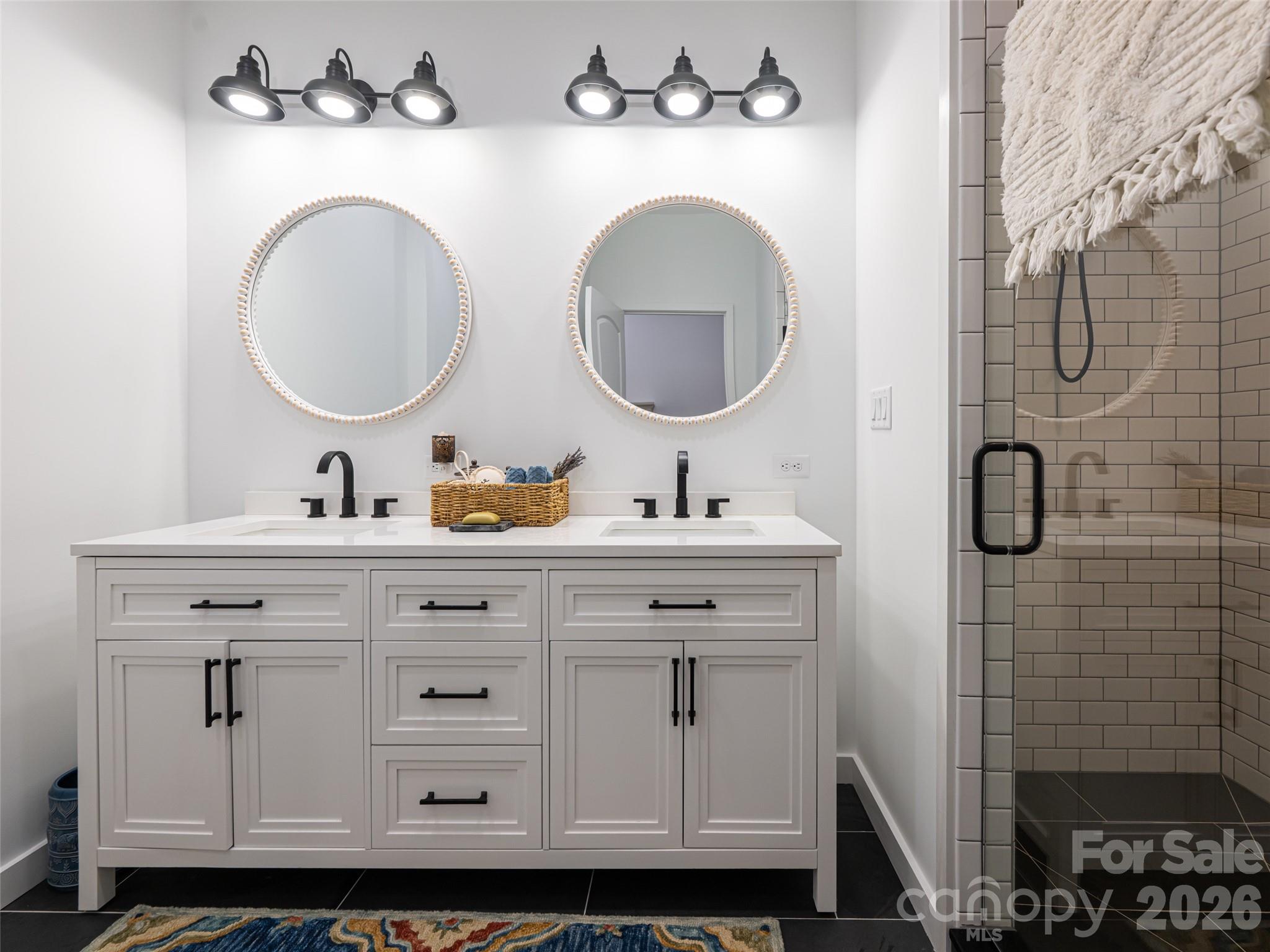 508 Avery Creek Road Arden, NC 28704 - Photo 30 of 47 a bathroom with a double vanity sink mirror and toilet