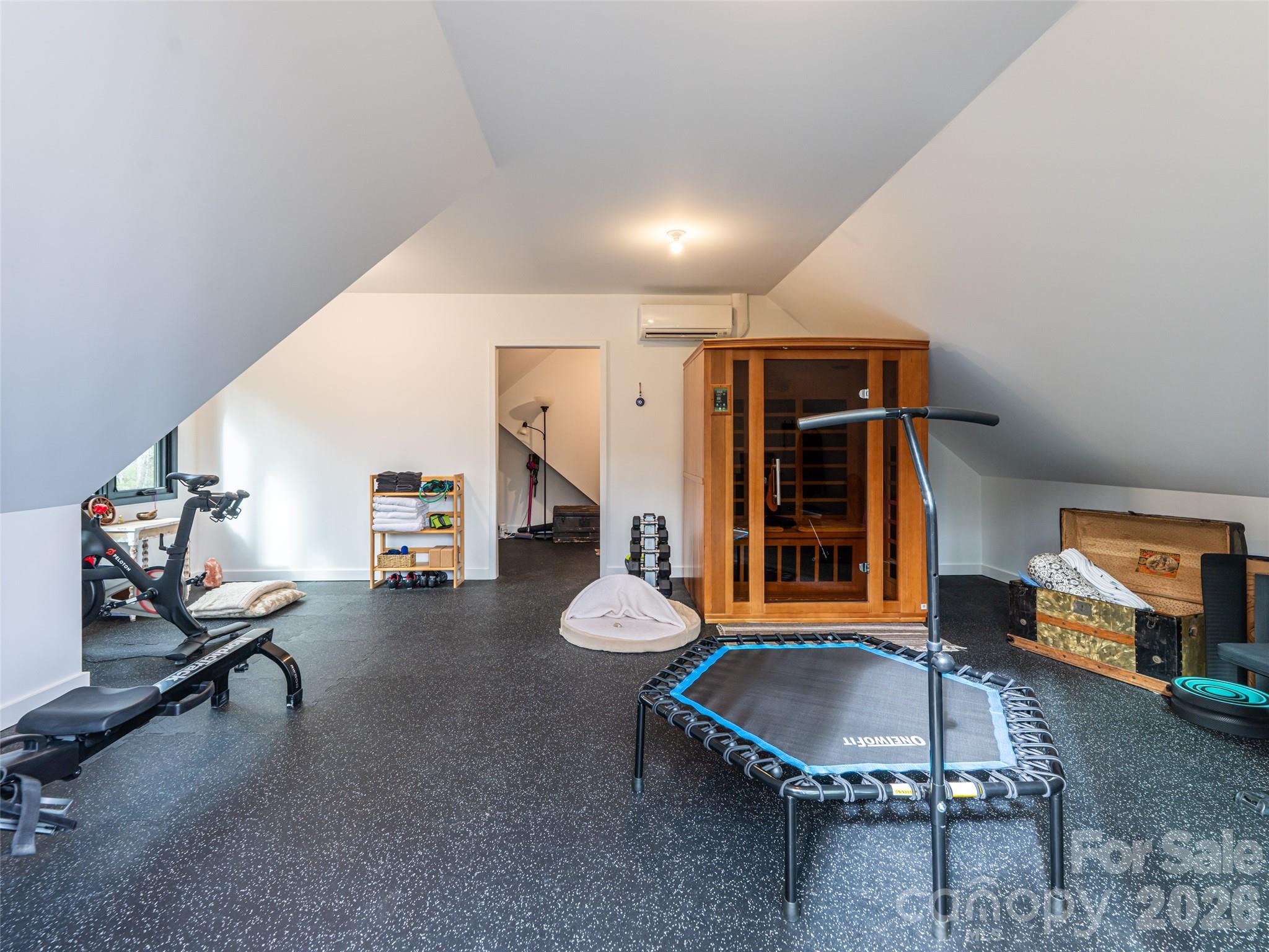 508 Avery Creek Road Arden, NC 28704 - Photo 33 of 47 a living room with furniture a window and gym equipment