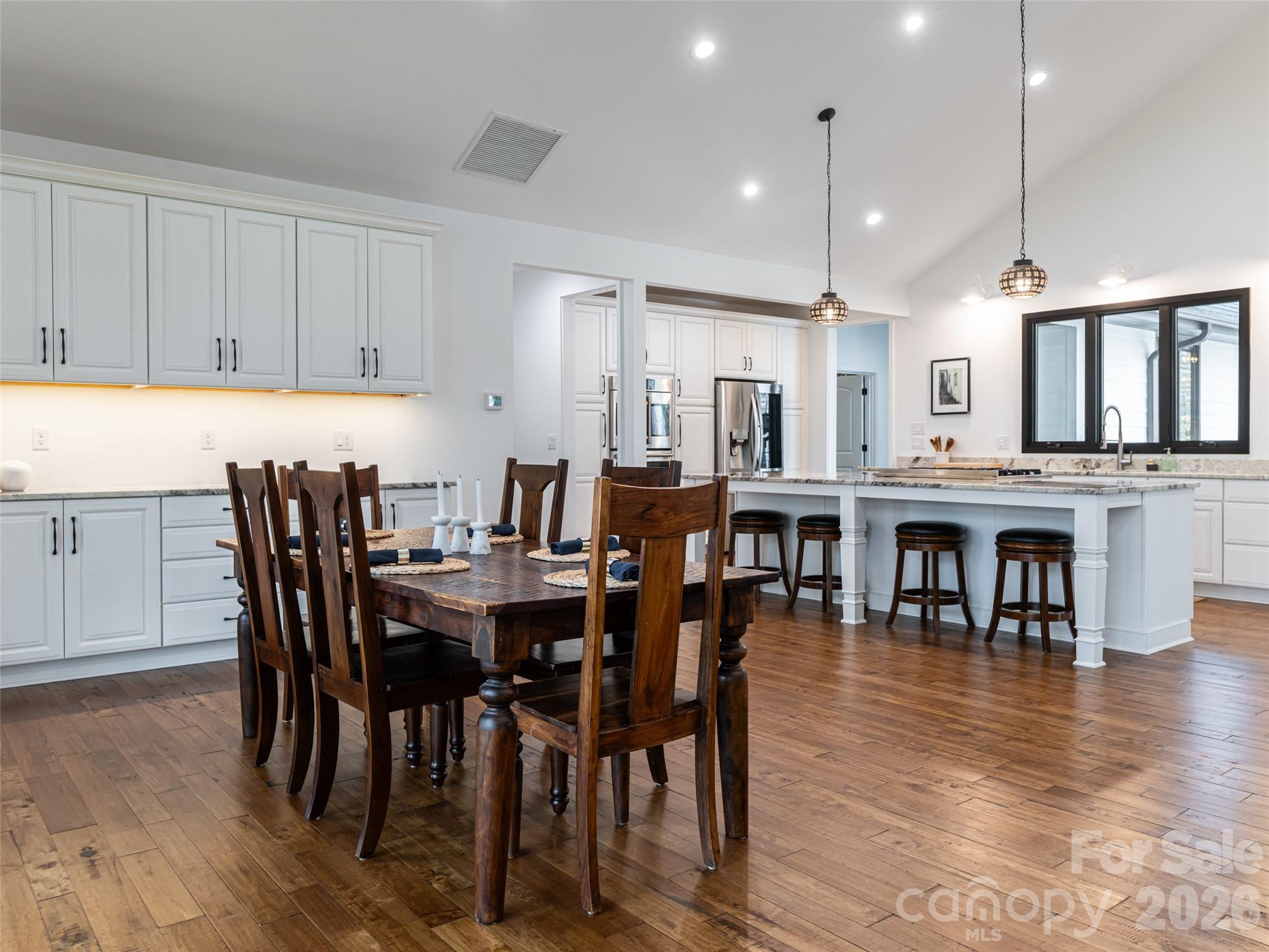 508 Avery Creek Road Arden, NC 28704 - Photo 8 of 47 a view of a dining area with furniture and wooden floor