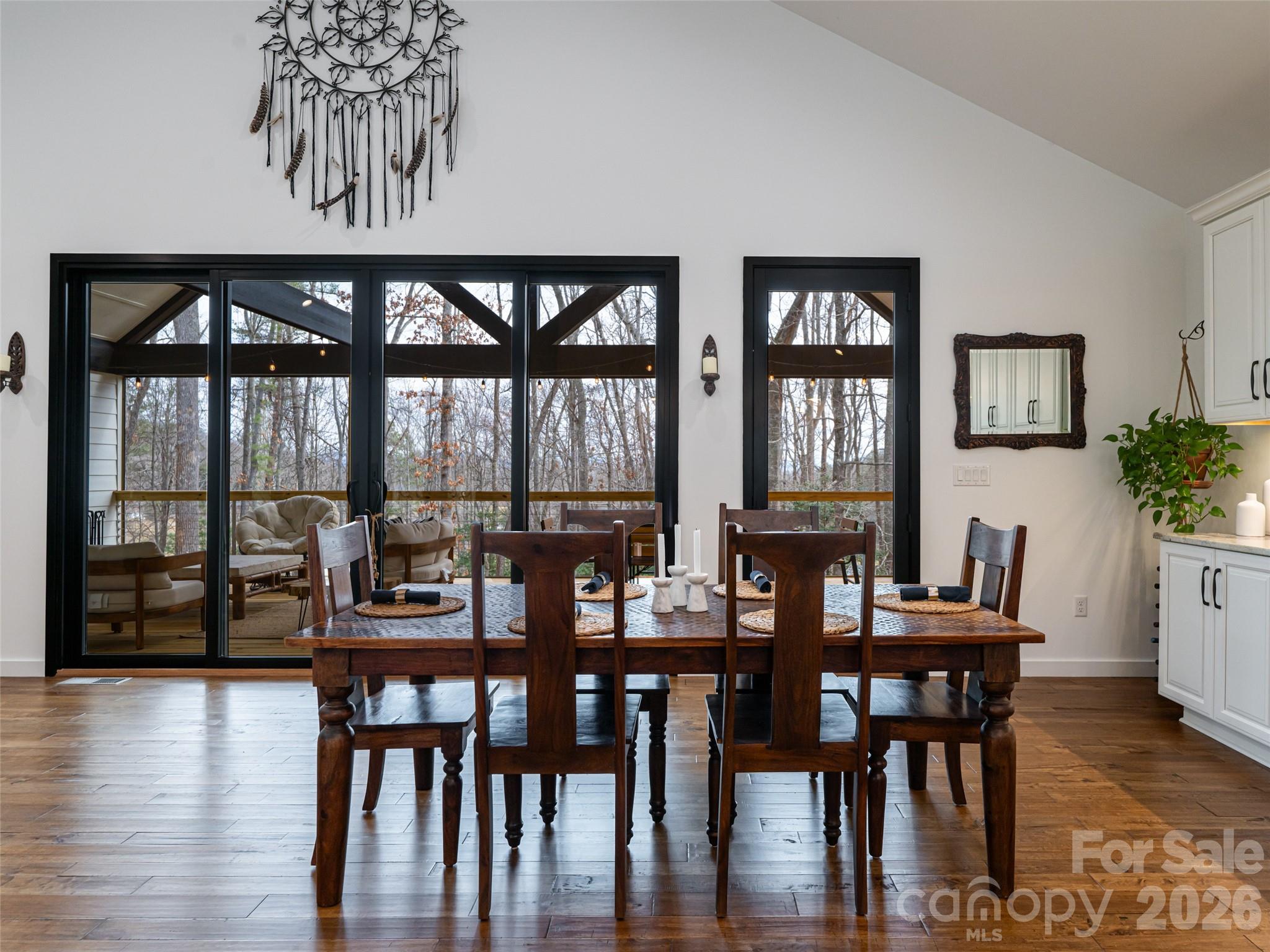 508 Avery Creek Road Arden, NC 28704 - Photo 10 of 47 a view of a dining room with furniture window and wooden floor