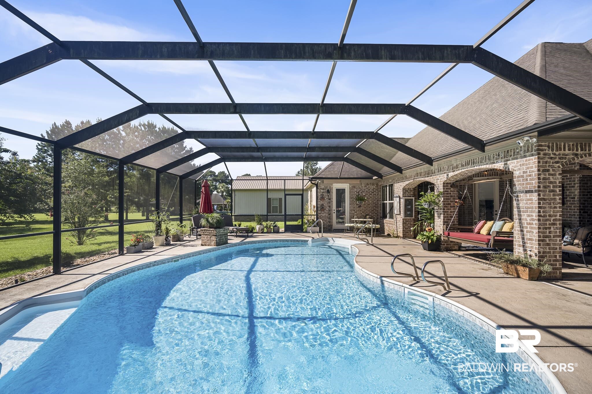 25212 Austin Road Daphne, AL 36526 - Photo 47 of 56 Outdoor pool with screened enclosure and a patio