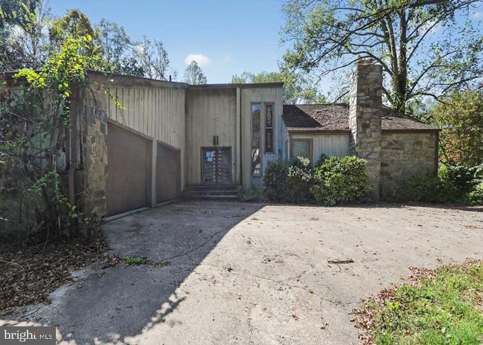 6320 Windpatterns Trail Fairfax Station, VA 22039 - Photo 4 of 21 front view of a house with a yard