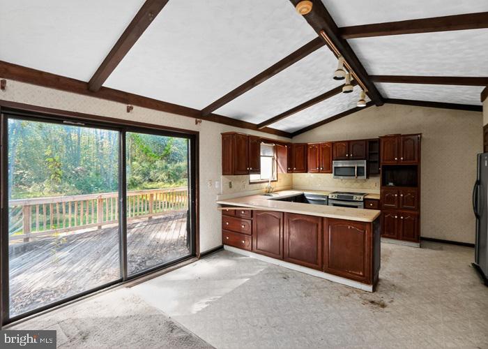 6320 Windpatterns Trail Fairfax Station, VA 22039 - Photo 9 of 21 a large kitchen with stainless steel appliances granite countertop a stove and a sink