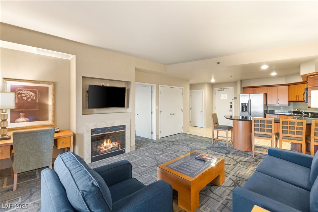 Living area featuring a high end fireplace and recessed lighting