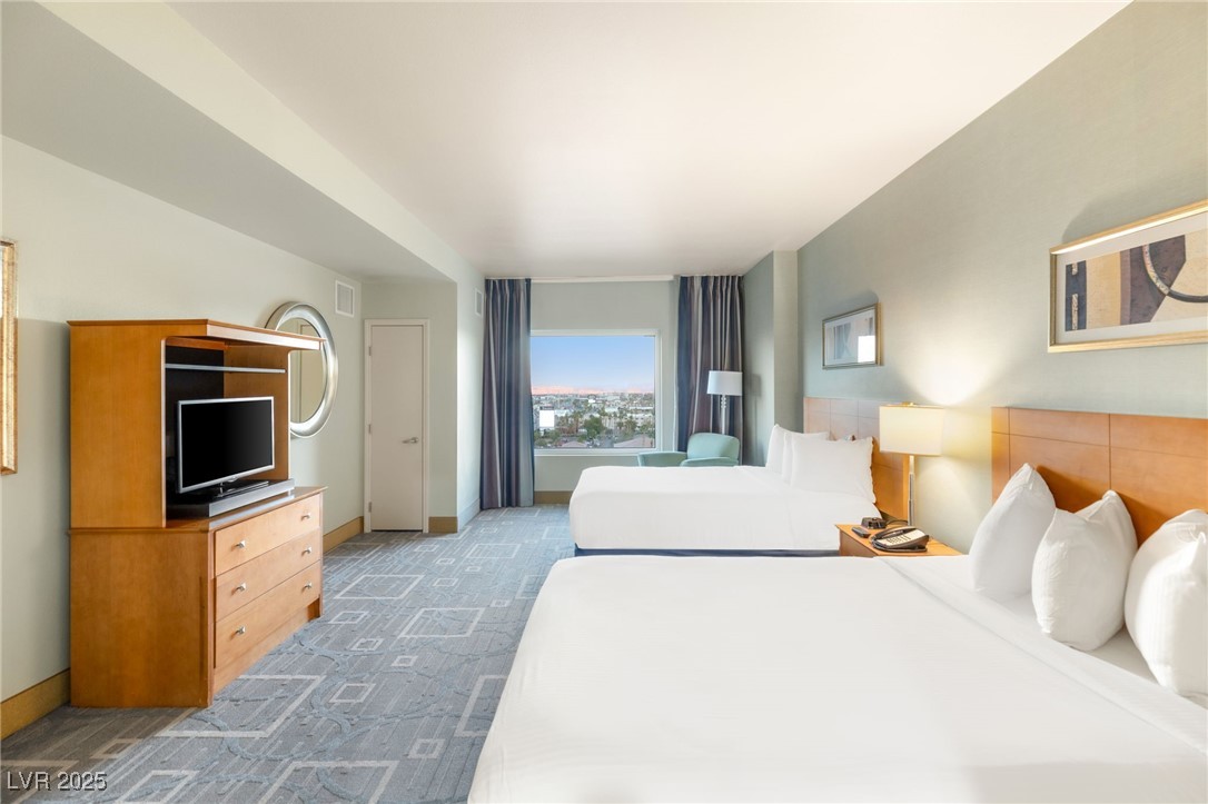 211 East Flamingo Road, Unit 610 Las Vegas, NV 89169 - Photo 11 of 42 Bedroom featuring carpet floors and baseboards