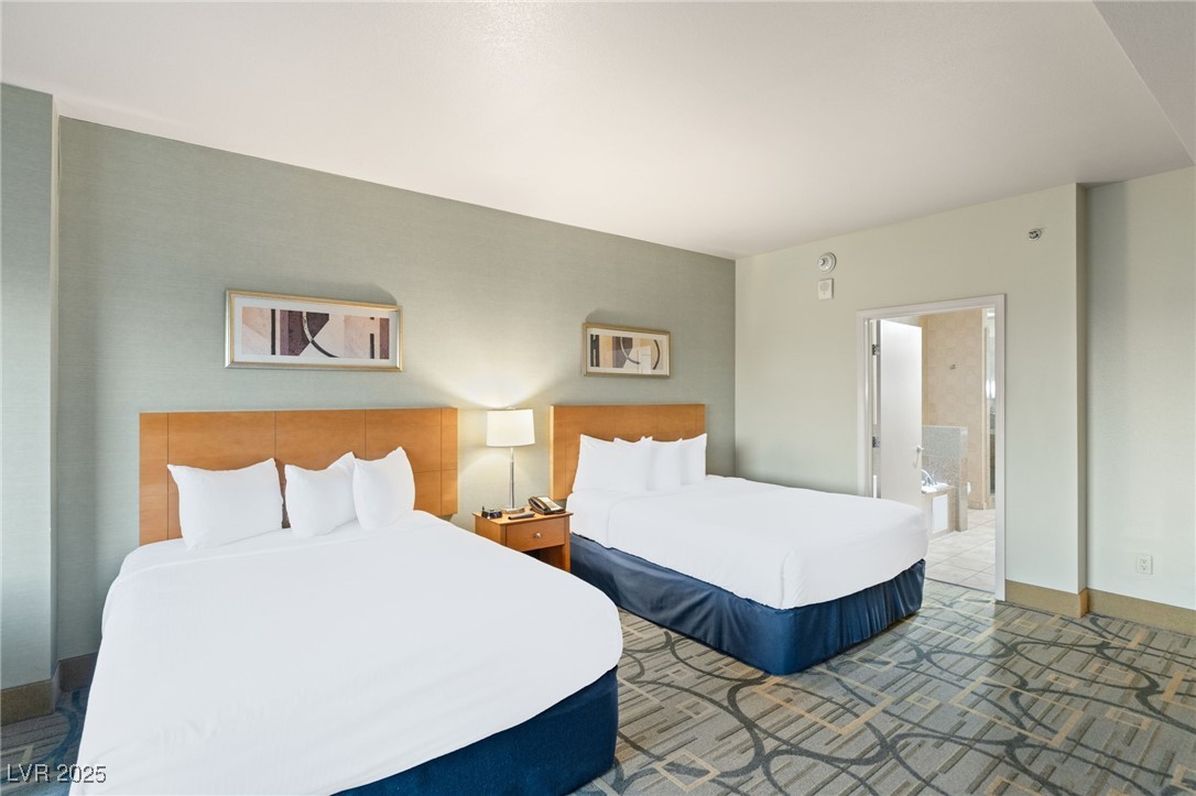 211 East Flamingo Road, Unit 610 Las Vegas, NV 89169 - Photo 12 of 42 Bedroom featuring baseboards