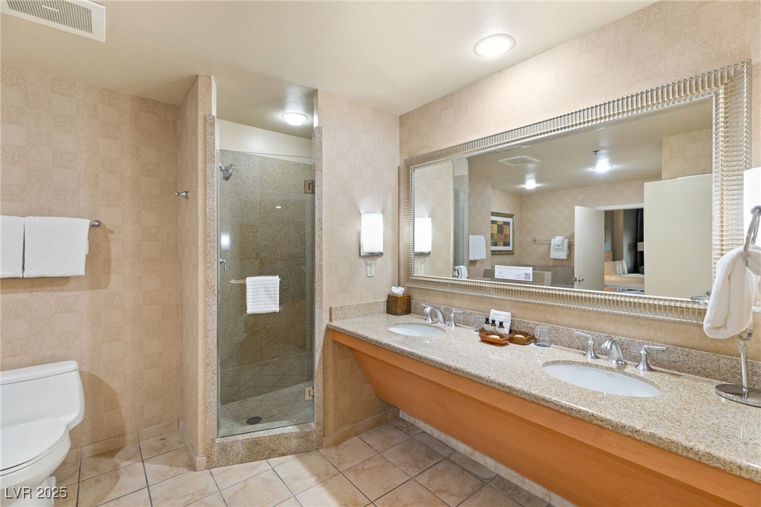 211 East Flamingo Road, Unit 610 Las Vegas, NV 89169 - Photo 17 of 42 Full bathroom featuring tile patterned flooring, visible vents, a sink, and toilet