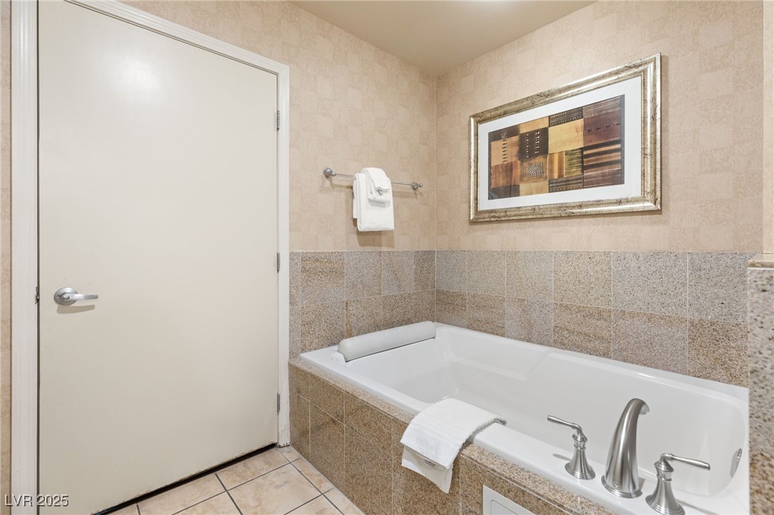 211 East Flamingo Road, Unit 610 Las Vegas, NV 89169 - Photo 18 of 42 Full bath with a garden tub and tile patterned flooring