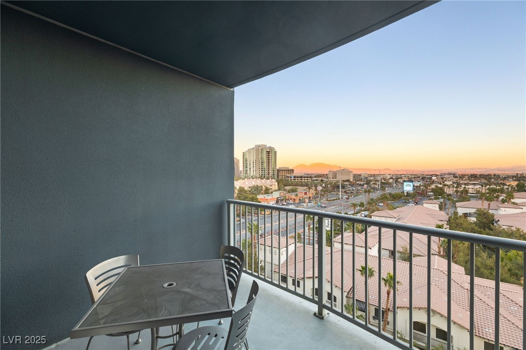 211 East Flamingo Road, Unit 610 Las Vegas, NV 89169 - Photo 22 of 42 Balcony at dusk featuring a view of city