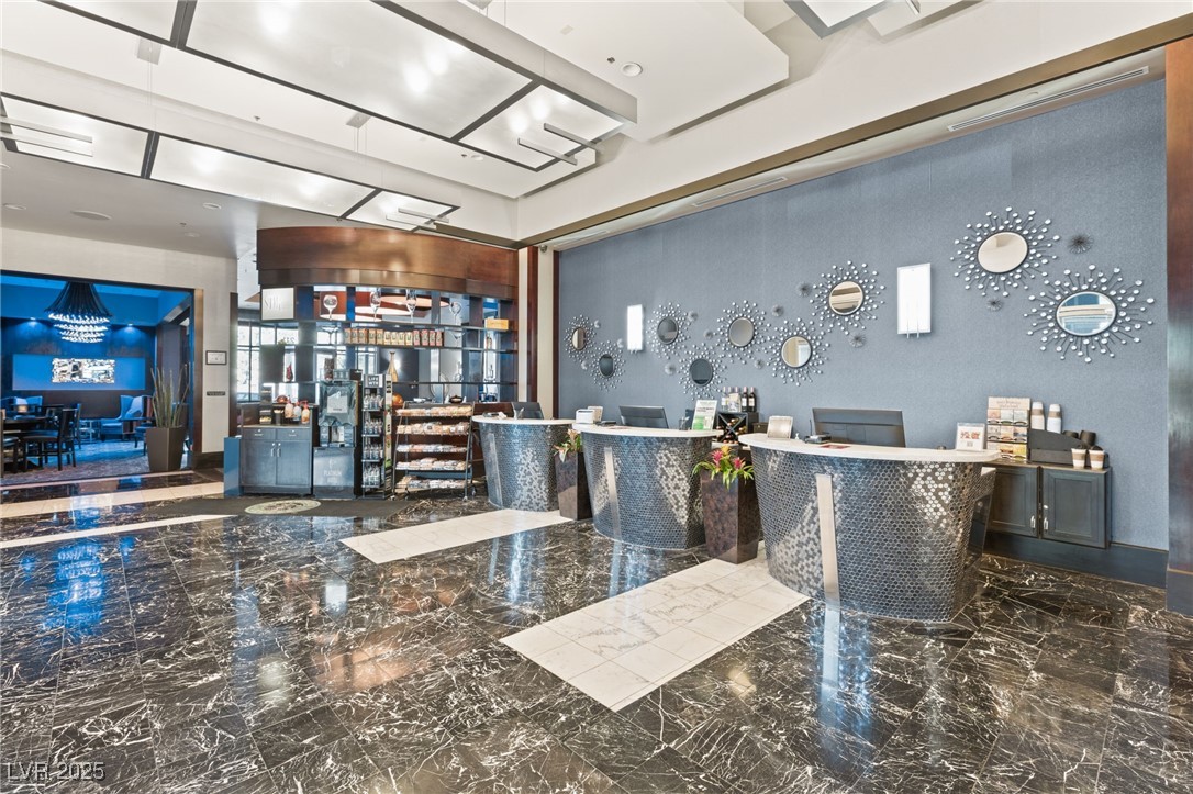 211 East Flamingo Road, Unit 610 Las Vegas, NV 89169 - Photo 28 of 42 Reception area featuring a bar