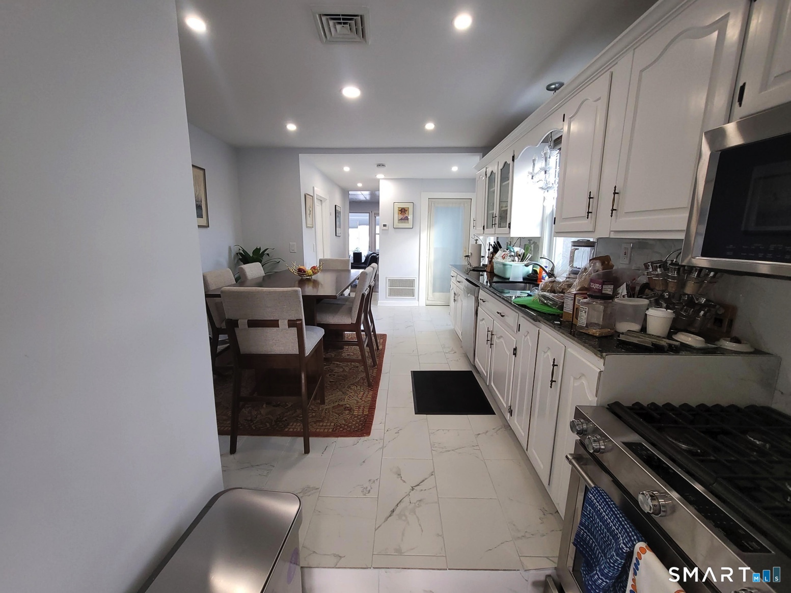 37 Biro Street Fairfield, CT 06825 - Photo 11 of 21 a kitchen with sink and stove top oven
