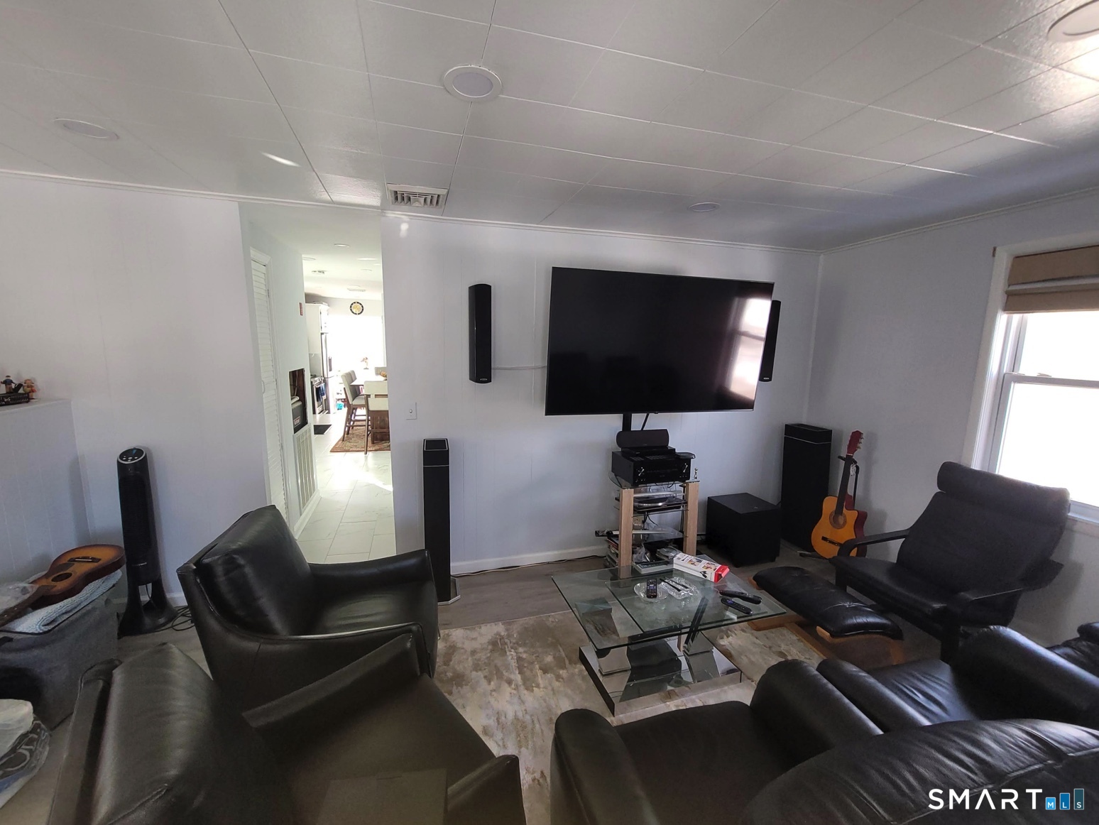 37 Biro Street Fairfield, CT 06825 - Photo 4 of 21 a living room with furniture a flat screen tv and a window