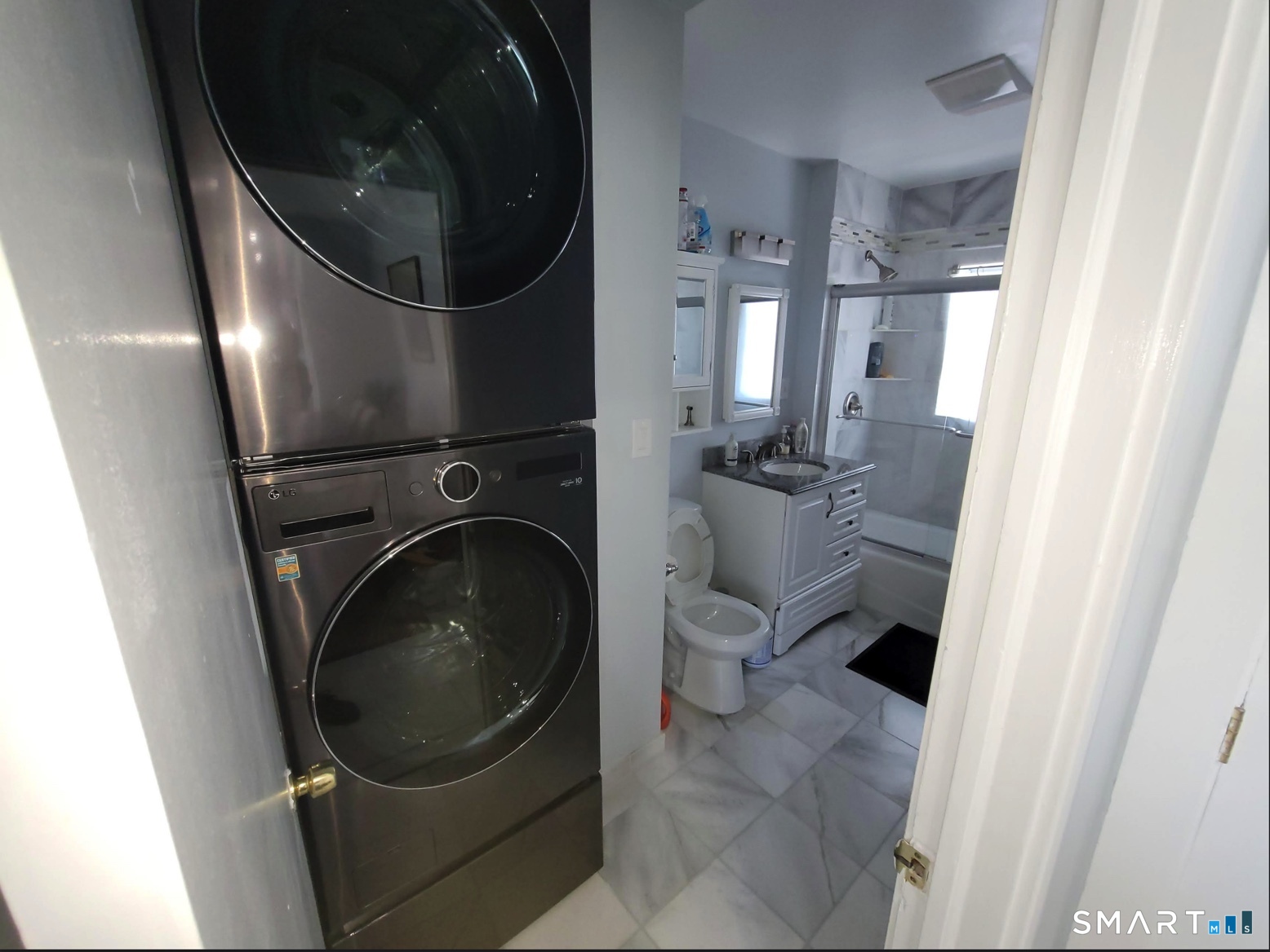 37 Biro Street Fairfield, CT 06825 - Photo 6 of 21 a close view of a washer and dryer in a utility room