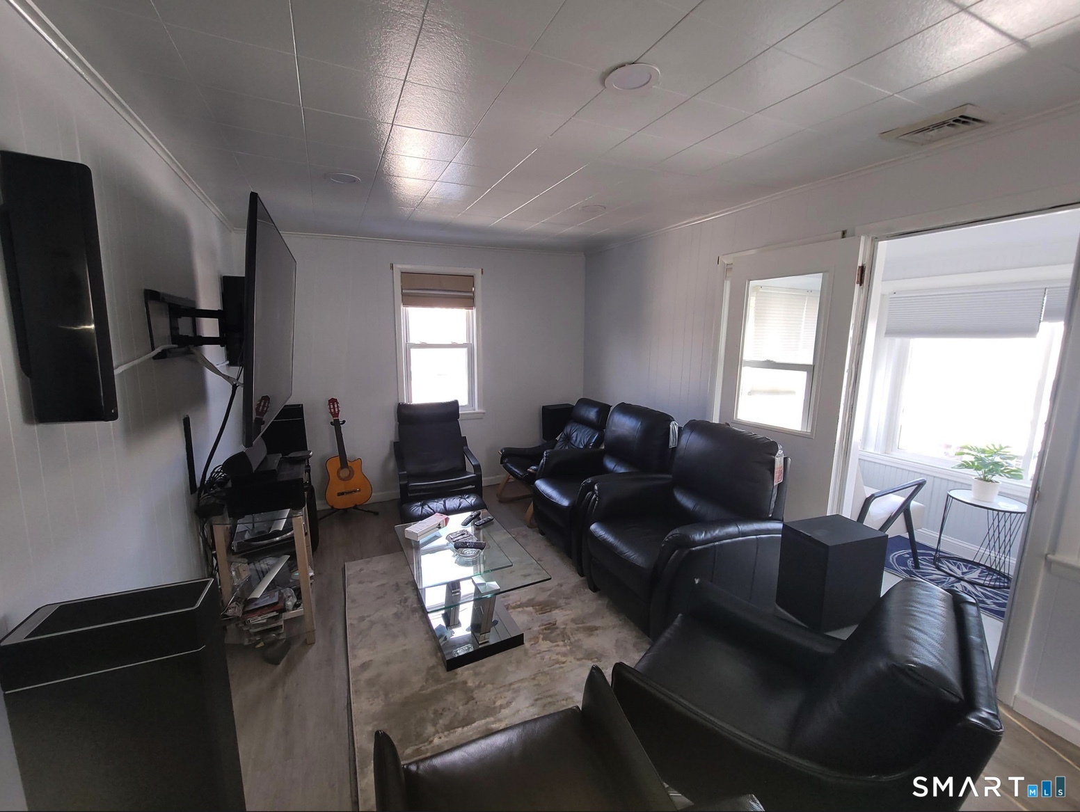 37 Biro Street Fairfield, CT 06825 - Photo 8 of 21 a living room with furniture and a flat screen tv