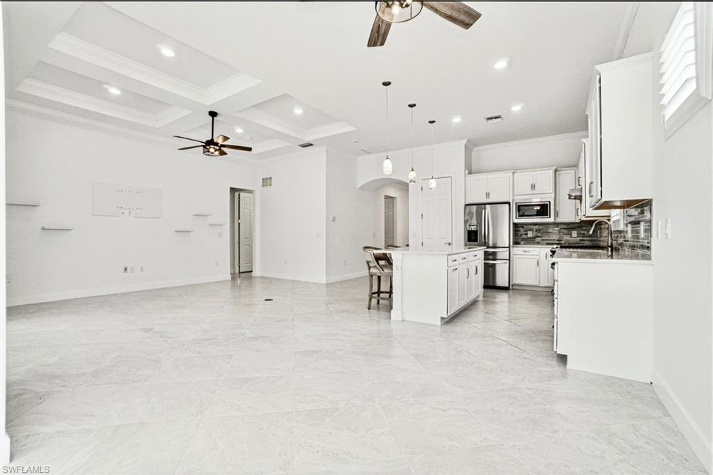 9395 Greyhawk Trail Naples, FL 34120 - Photo 37 of 37 a view of kitchen with furniture and stainless steel appliances