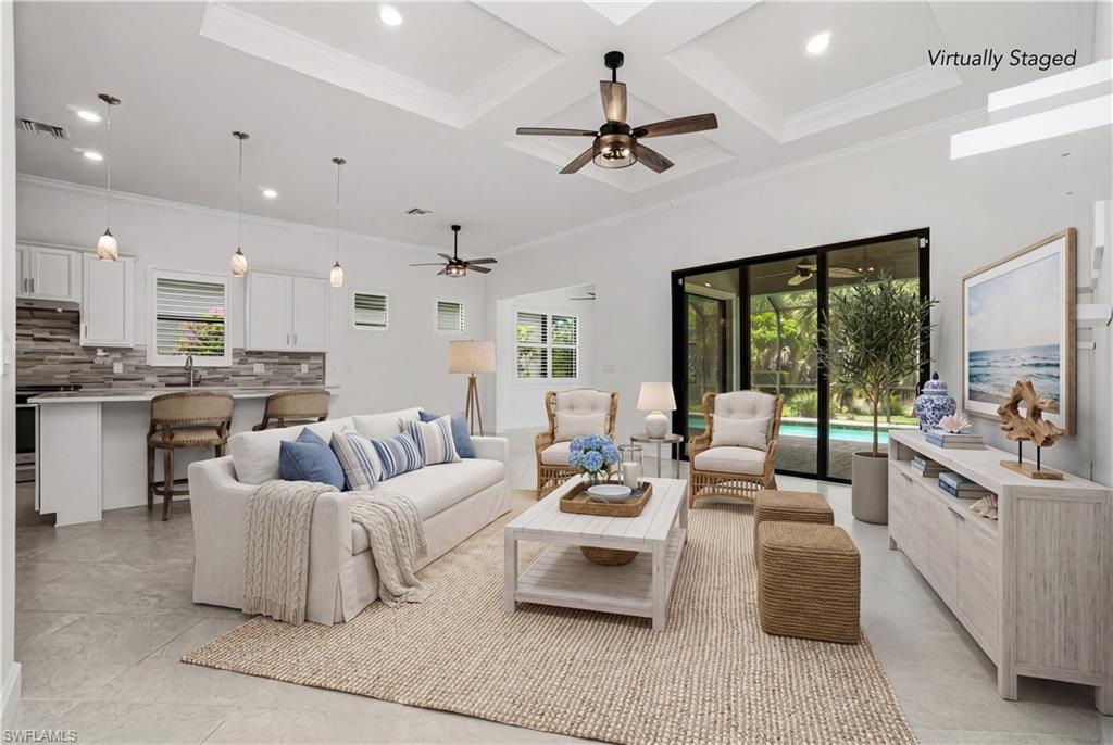 9395 Greyhawk Trail Naples, FL 34120 - Photo 5 of 37 a living room with furniture and a large window