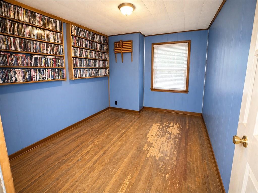 101 Fishpot Road Fredericktown, PA 15333 - Photo 13 of 21 a view of empty room with wooden floor and fan