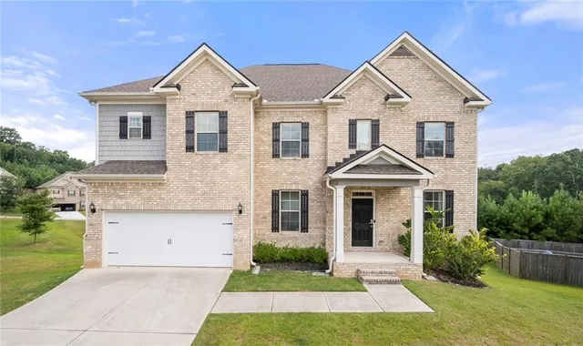 front view of a house with a yard