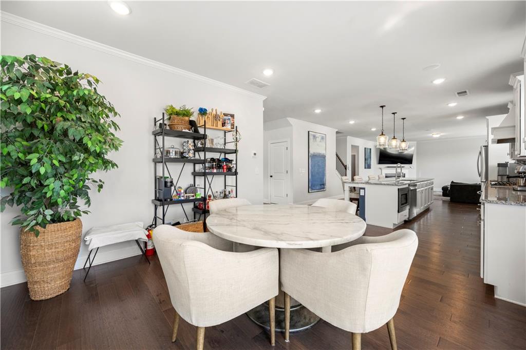 130 Sycamore Row Atlanta, GA 30331 - Photo 11 of 42 a dining room with furniture and wooden floor