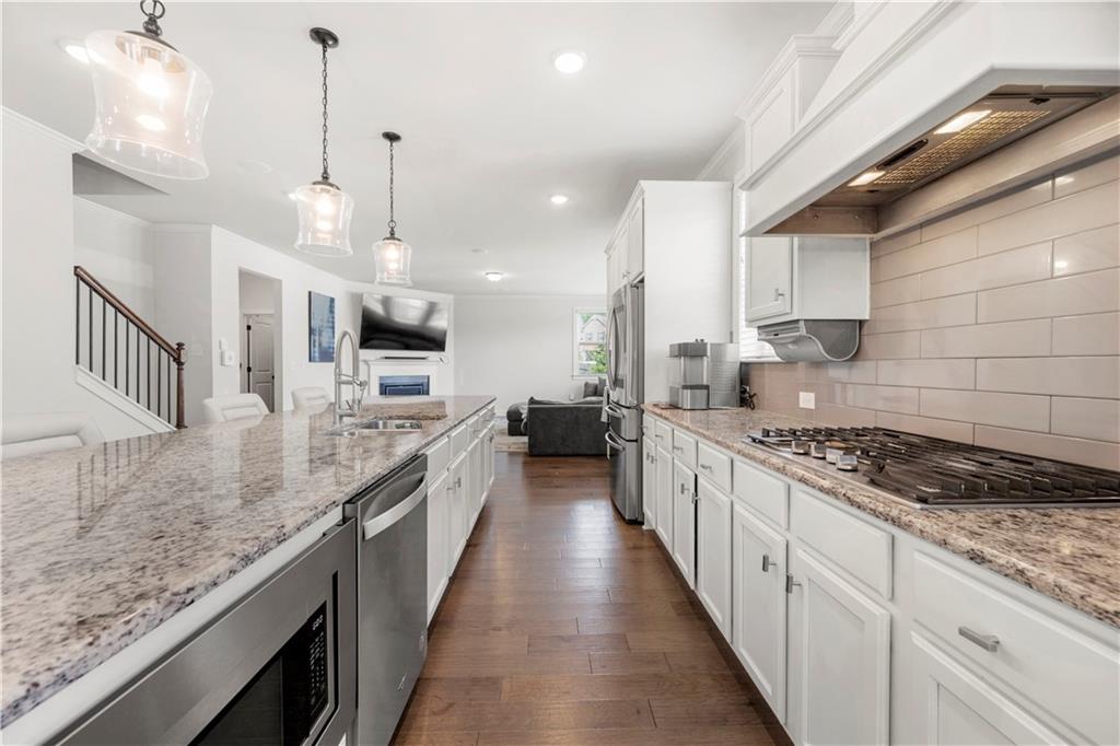 130 Sycamore Row Atlanta, GA 30331 - Photo 12 of 42 a large kitchen with kitchen island lots of counter space a sink and appliances