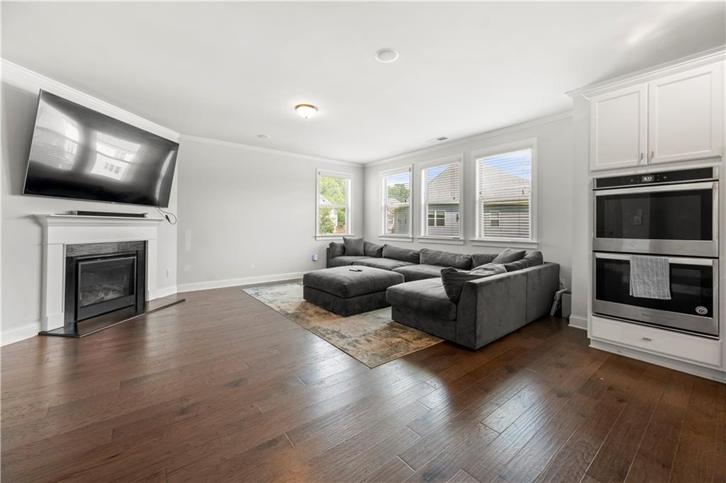 130 Sycamore Row Atlanta, GA 30331 - Photo 13 of 42 a living room with furniture flat screen tv and a fireplace