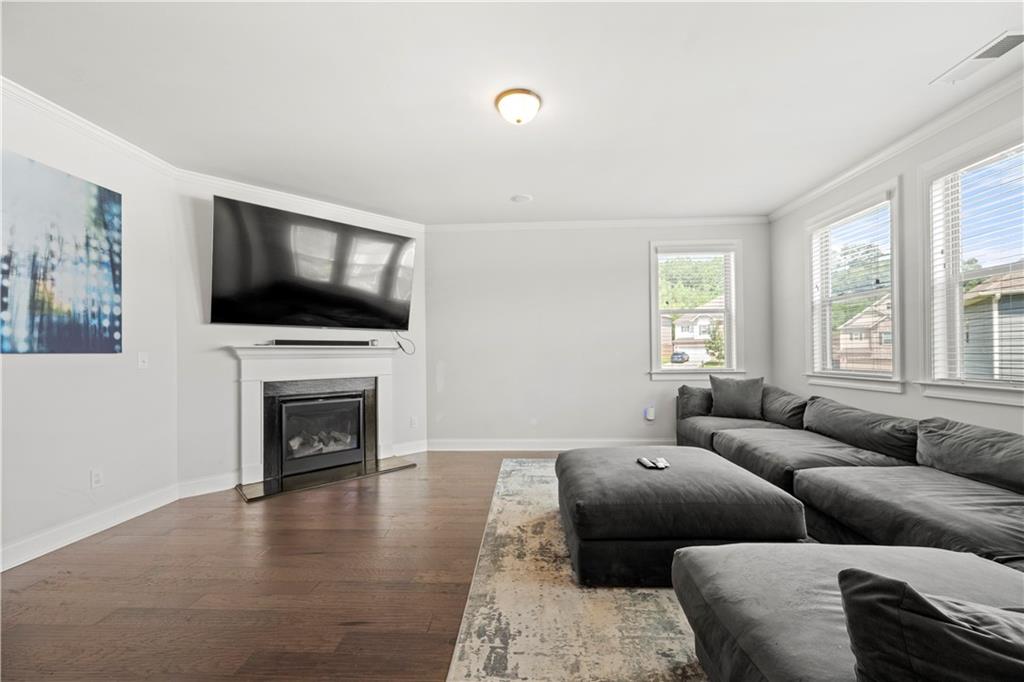 130 Sycamore Row Atlanta, GA 30331 - Photo 16 of 42 a living room with furniture and a flat screen tv