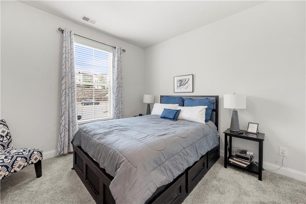 130 Sycamore Row Atlanta, GA 30331 - Photo 17 of 42 a bedroom with a bed and a window