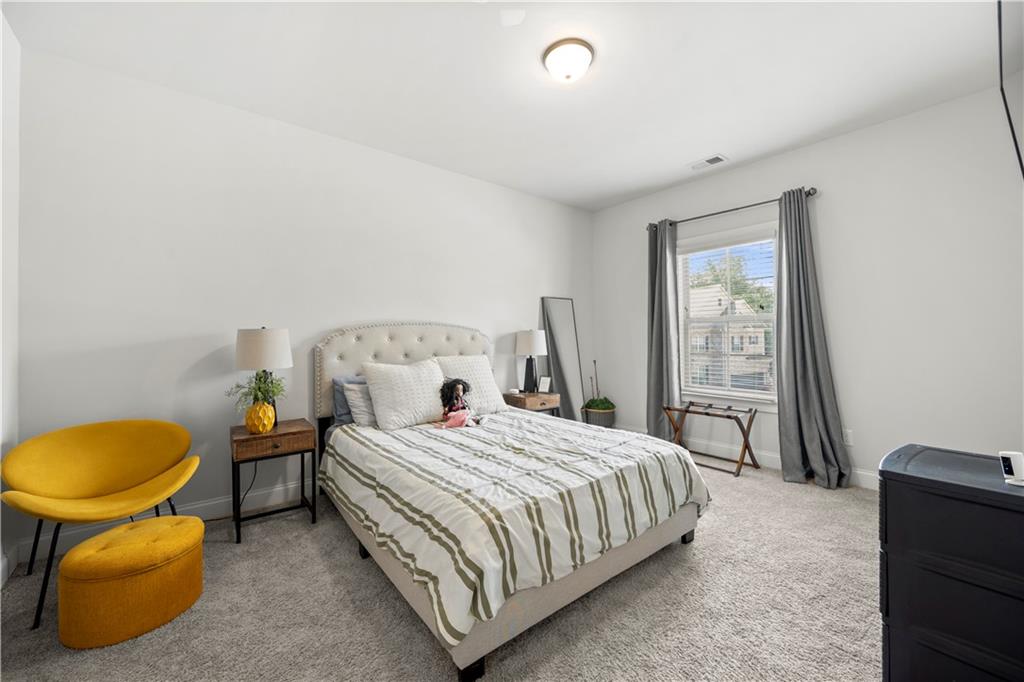 130 Sycamore Row Atlanta, GA 30331 - Photo 19 of 42 a bedroom with a bed and a window