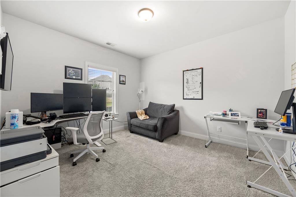 130 Sycamore Row Atlanta, GA 30331 - Photo 20 of 42 a living room with furniture and a flat screen tv