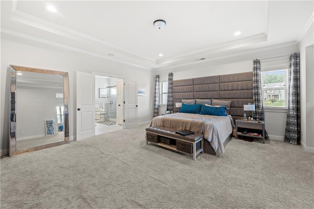 130 Sycamore Row Atlanta, GA 30331 - Photo 24 of 42 a bedroom with a bed and ceiling fan