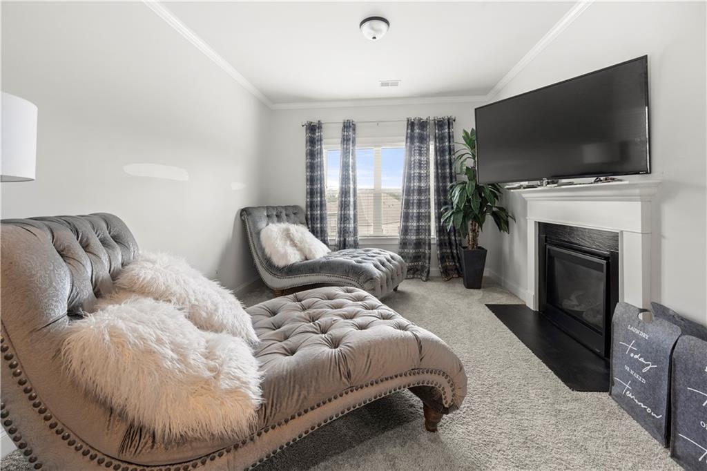 130 Sycamore Row Atlanta, GA 30331 - Photo 26 of 42 a living room with furniture and a flat screen tv