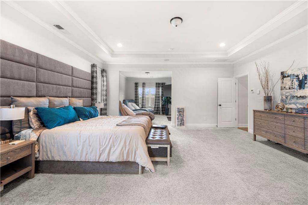 130 Sycamore Row Atlanta, GA 30331 - Photo 27 of 42 a bedroom with a bed and a view of kitchen