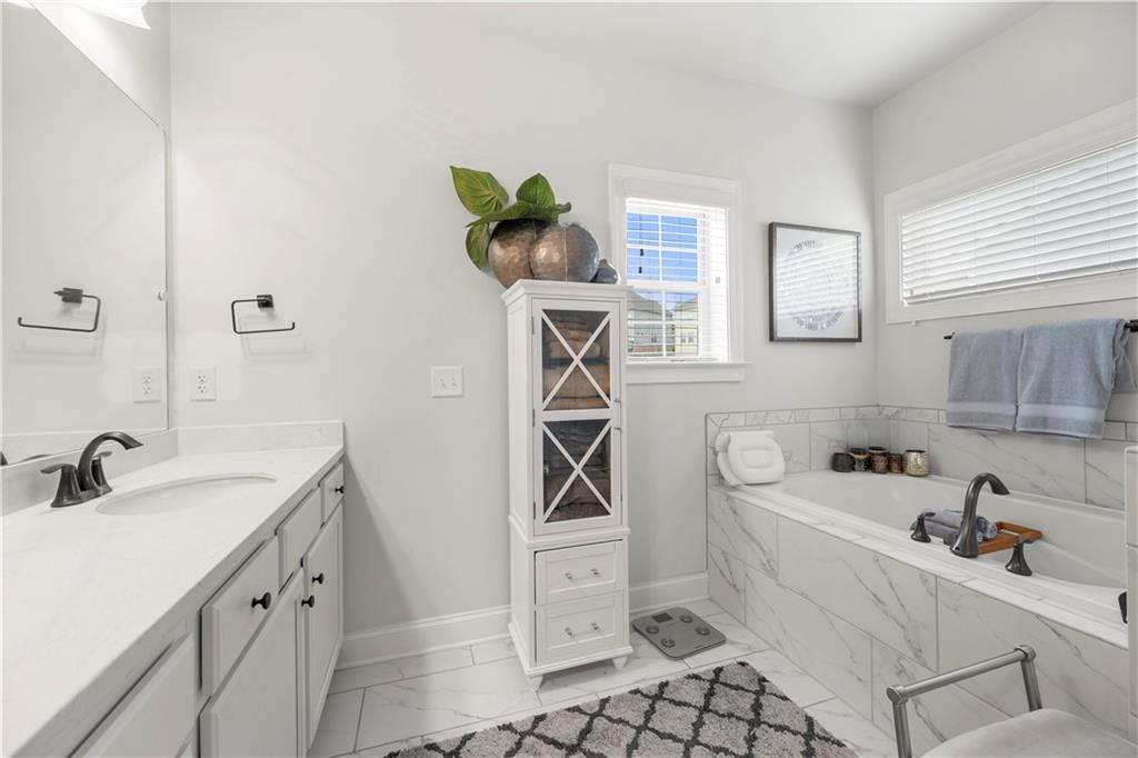 130 Sycamore Row Atlanta, GA 30331 - Photo 30 of 42 a bathroom with a sink a vanity and a toilet