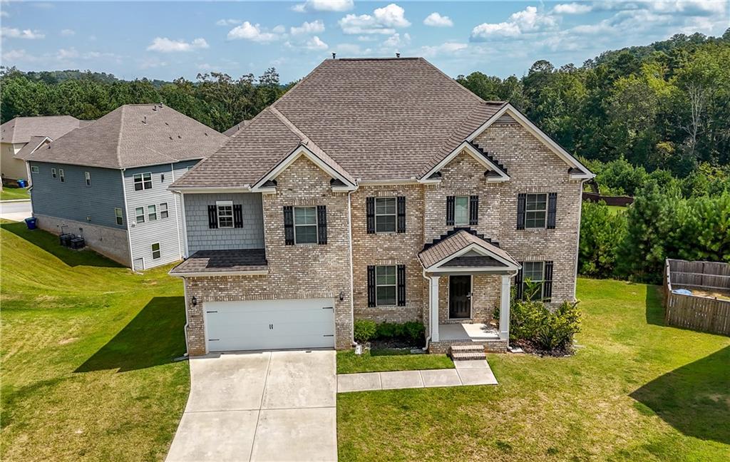 130 Sycamore Row Atlanta, GA 30331 - Photo 3 of 42 a front view of a house with a yard