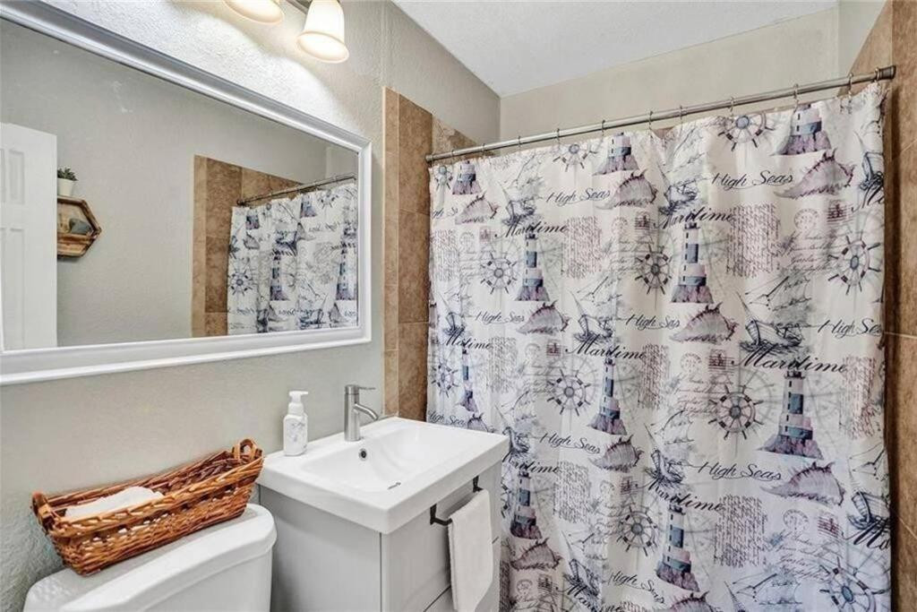 Undisclosed Address West Park, FL 33023 - Photo 8 of 22 a bathroom with a sink and a mirror