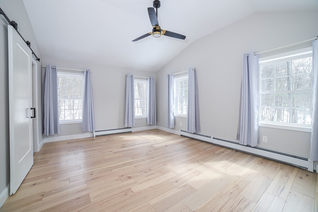 3 Woods Road Westminster, MA 01473 - Photo 20 of 42 a view of an empty room with window and wooden floor