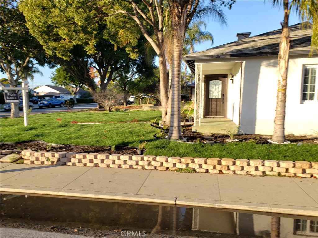 13185 14th Street Chino, CA 91710 - Photo 15 of 42 front view of a house with a yard