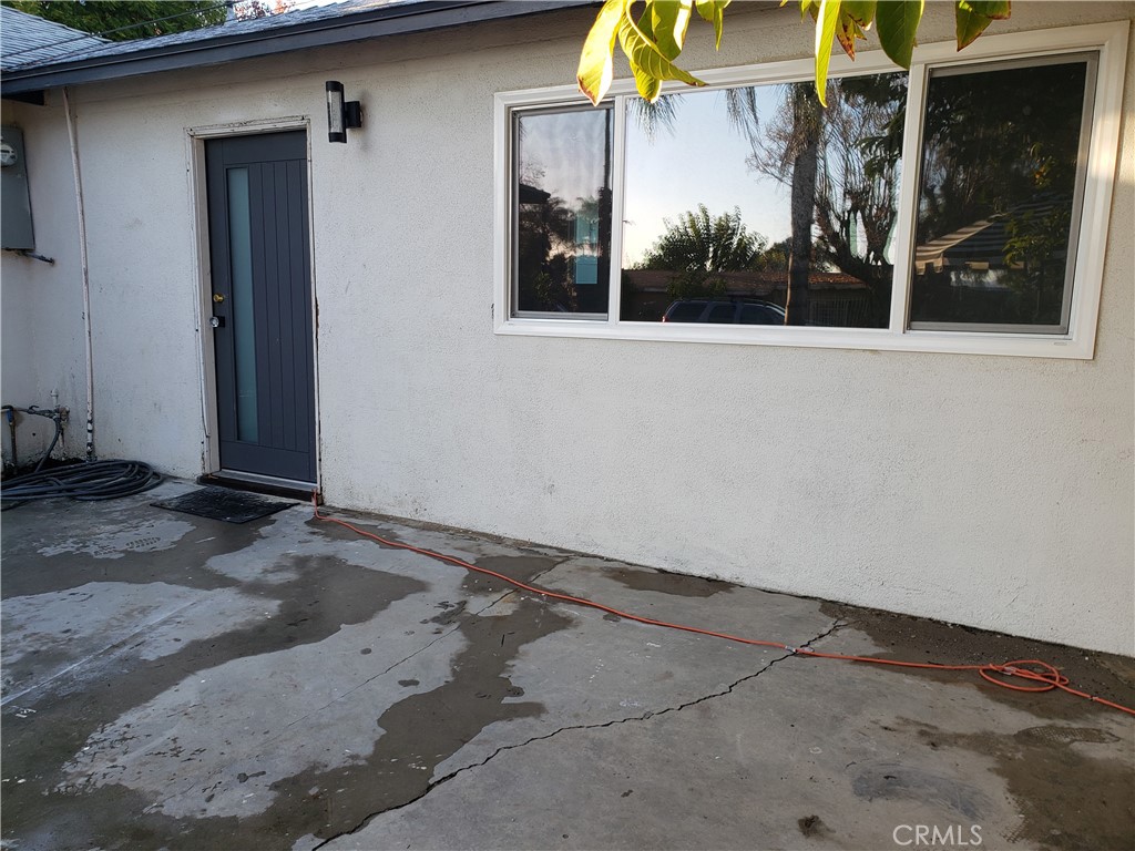 13185 14th Street Chino, CA 91710 - Photo 20 of 42 a view of a entryway door of the house