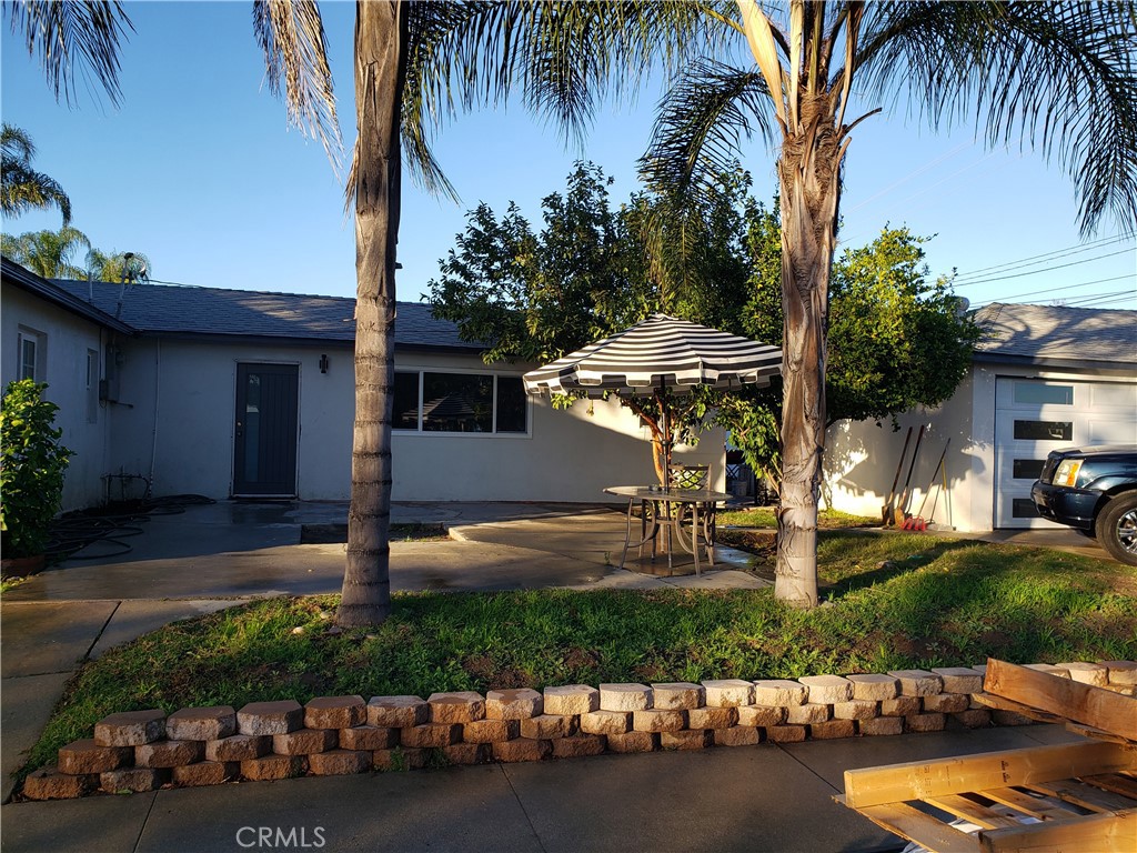 13185 14th Street Chino, CA 91710 - Photo 21 of 42 a front view of a house with garden