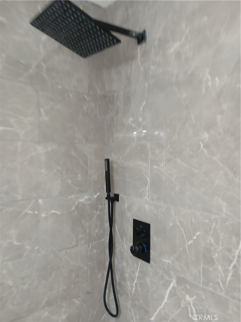 13185 14th Street Chino, CA 91710 - Photo 31 of 42 a bathroom with a shower