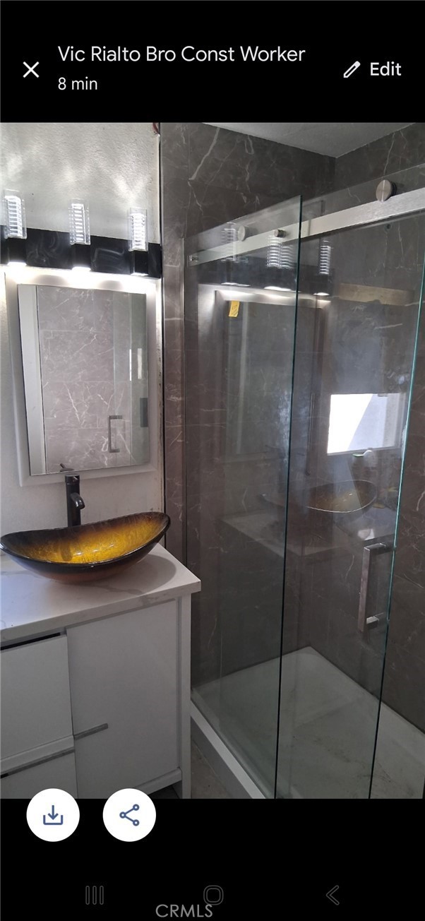 13185 14th Street Chino, CA 91710 - Photo 34 of 42 a bathroom with a sink a toilet and shower