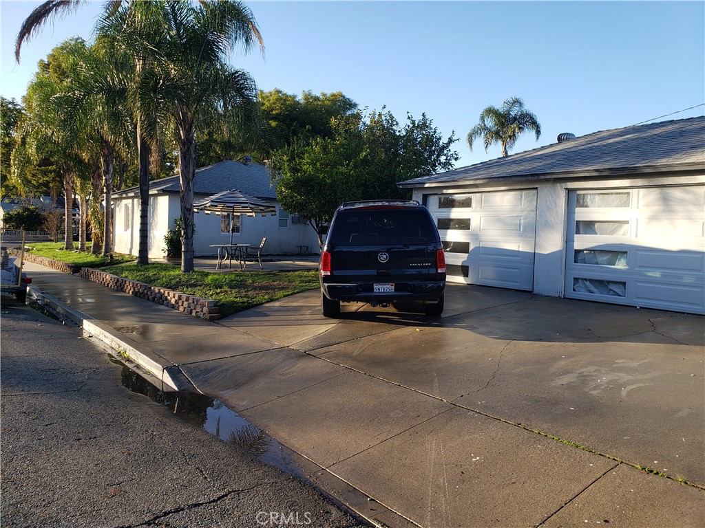 13185 14th Street Chino, CA 91710 - Photo 10 of 42 a car parked in front of a house