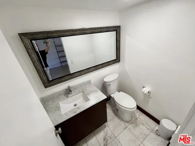 a view of a patio with table and chairs