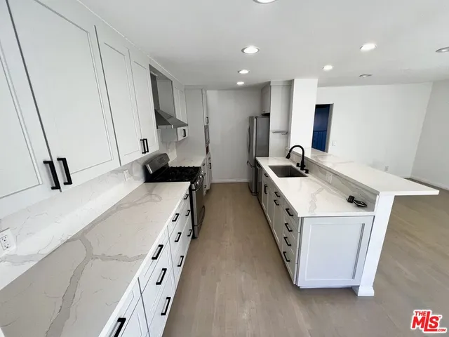 a bedroom with a bed and a ceiling fan