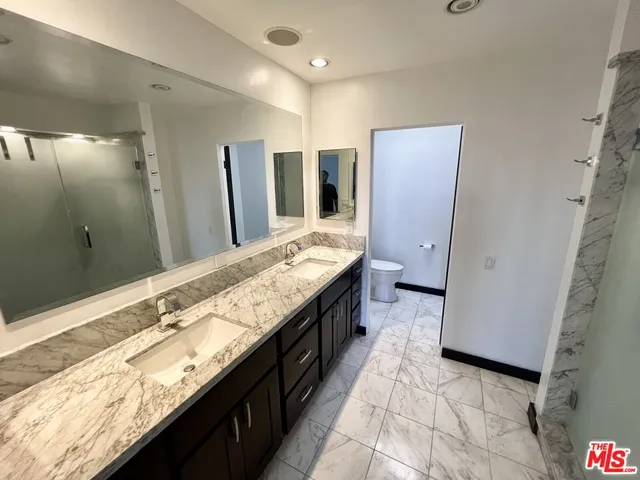 a room with gym equipment and windows