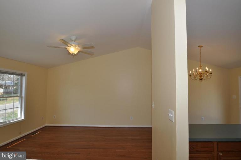 7401 Bull Run Road Manassas, VA 20111 - Photo 11 of 22 an empty room with wooden floor and windows